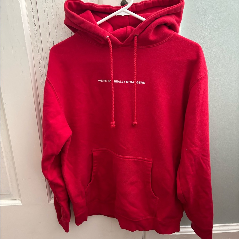 Red “We’re not really strangers” hoodie